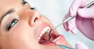Close-up of a woman undergoing a dental exam representing cosmetic dentistry in Plano, TX.